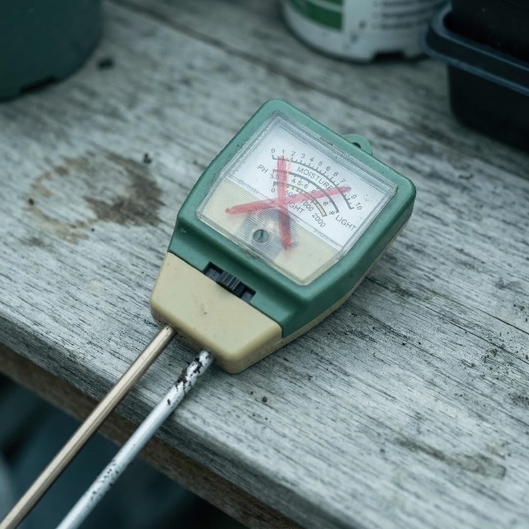 A 3-in-1 soil meter with a cluttered triple-scale dial, illustrating the confusing and inaccurate all-in-one design.